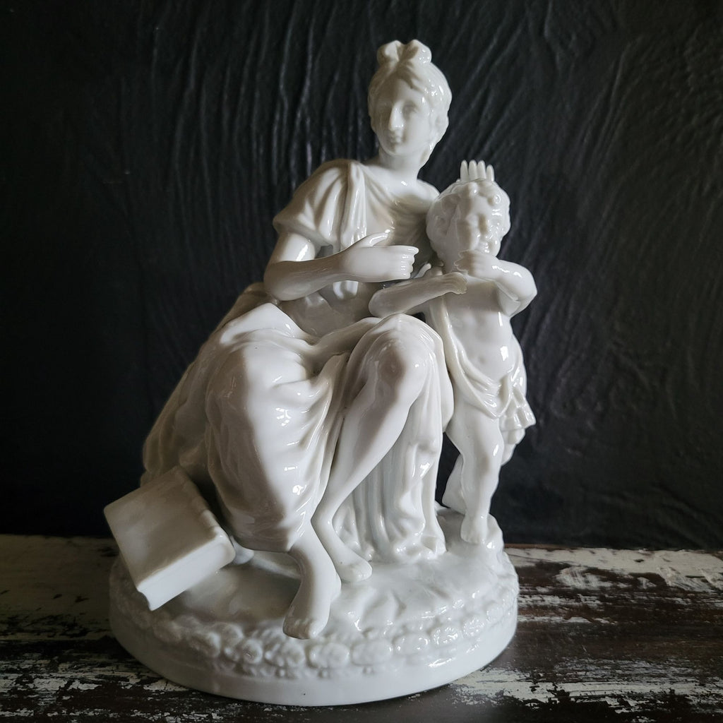 Vintage White Porcelain Figurine Of Woman and Child with Book On Floral Base