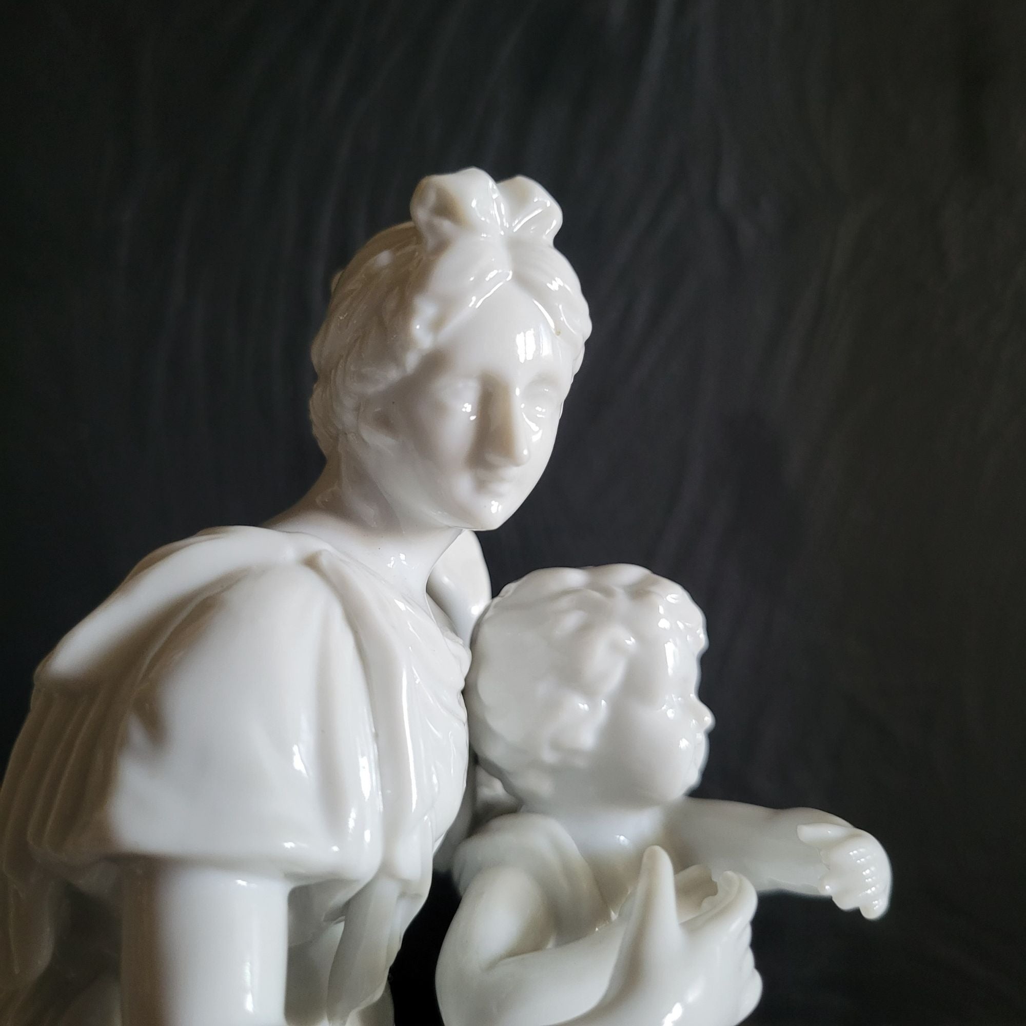Vintage White Porcelain Figurine Of Woman and Child with Book On Floral Base
