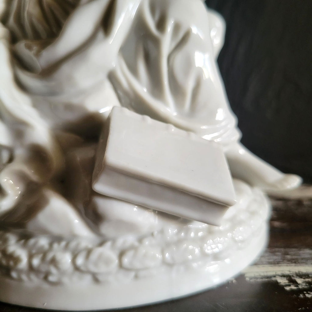 Vintage White Porcelain Figurine Of Woman and Child with Book On Floral Base