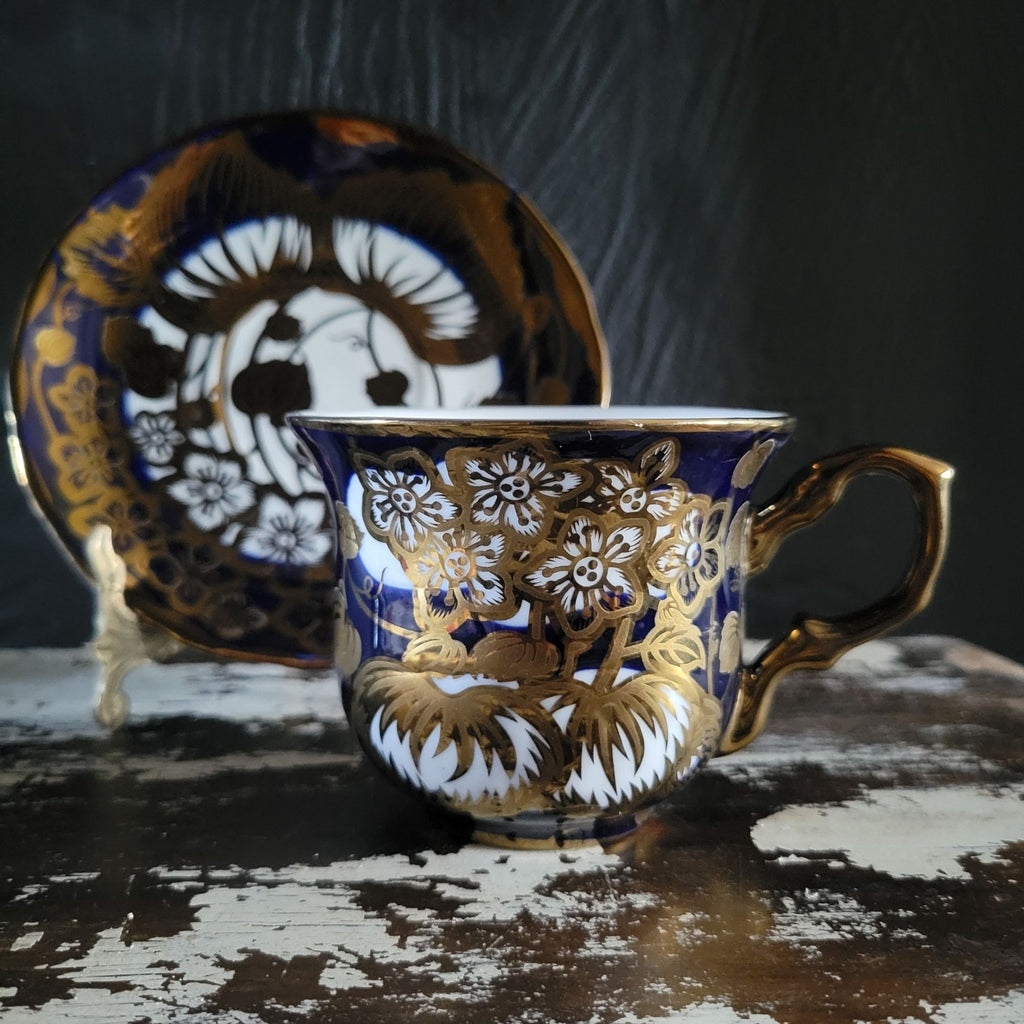 Vintage Cobalt Blue and Gold Porcelain Cup and Saucer with Floral Pattern