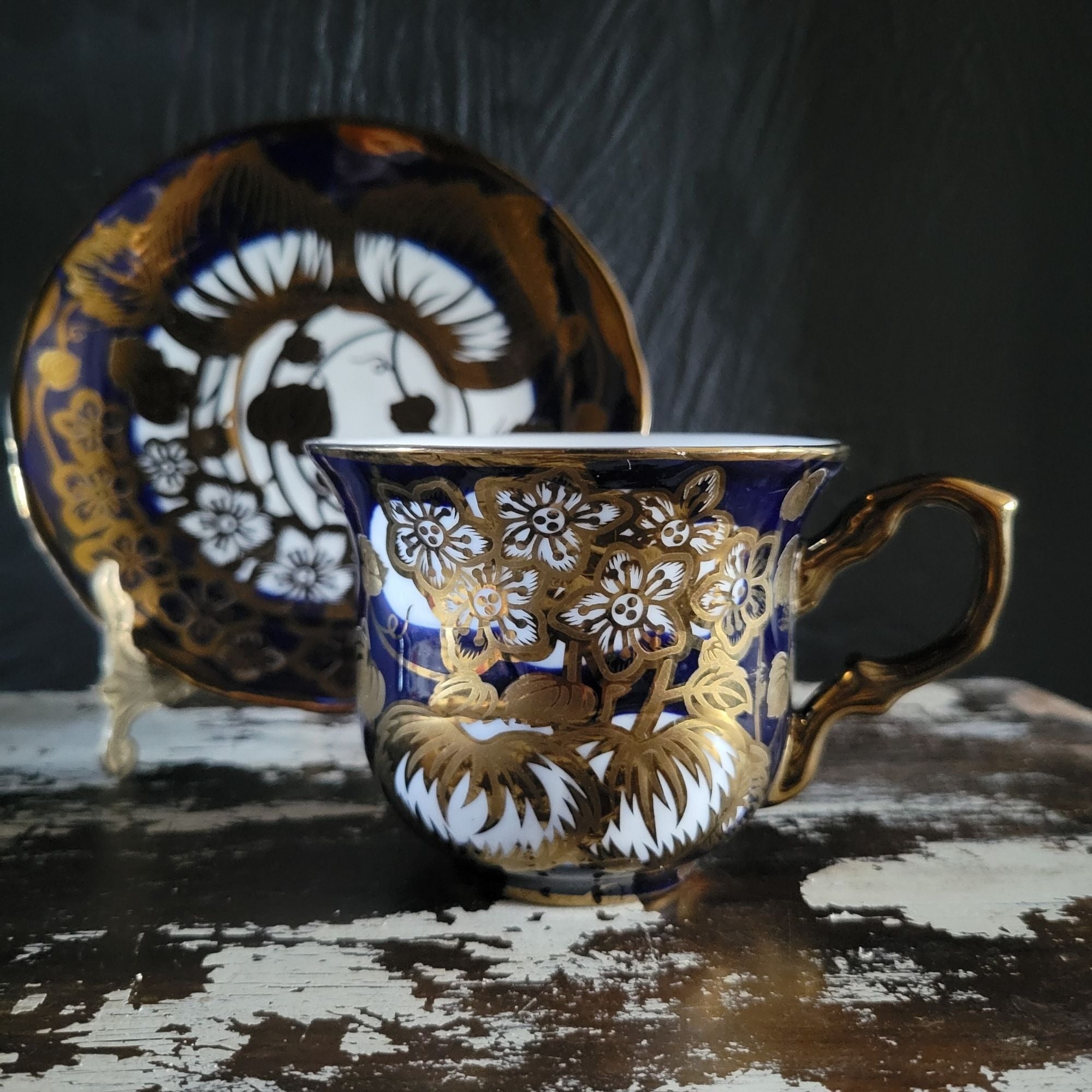 Vintage Cobalt Blue and Gold Porcelain Cup and Saucer with Floral Pattern