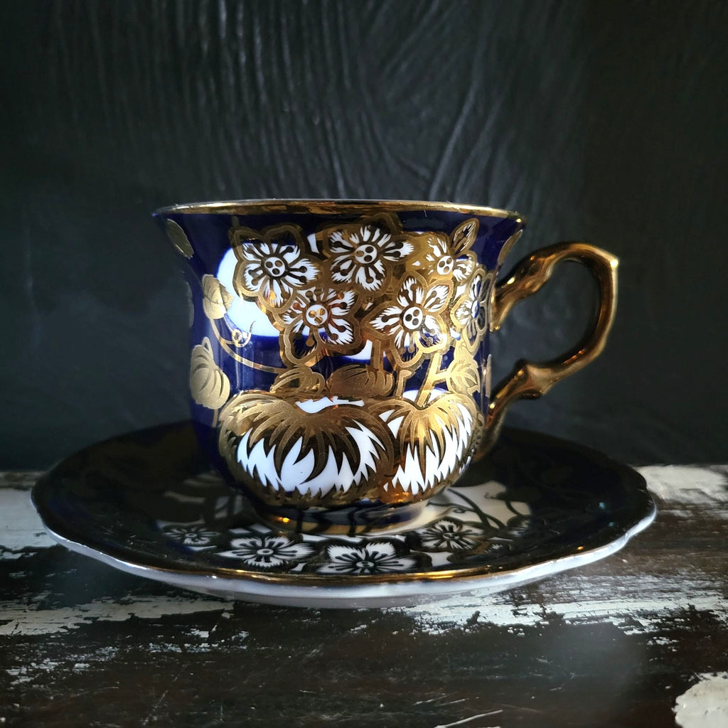 Vintage Cobalt Blue and Gold Porcelain Cup and Saucer with Floral Pattern