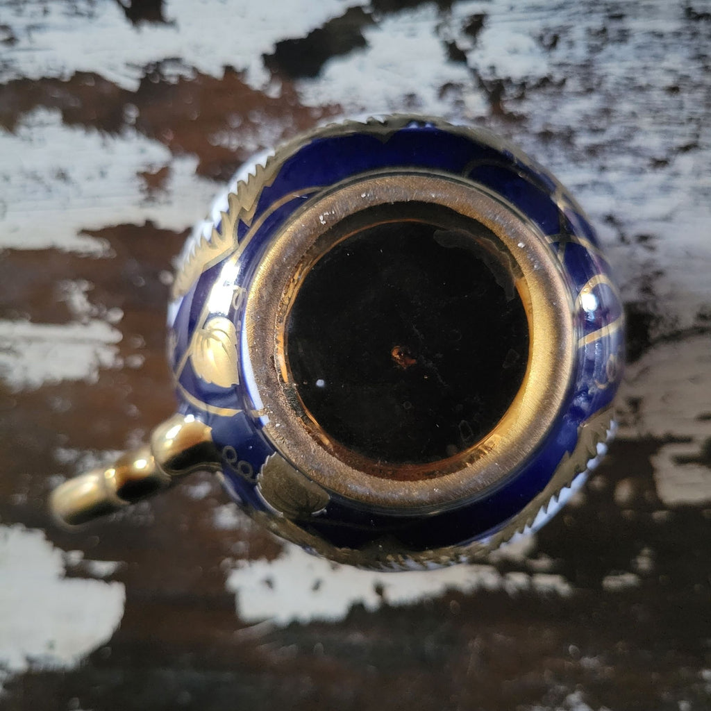 Vintage Cobalt Blue and Gold Porcelain Cup and Saucer with Floral Pattern