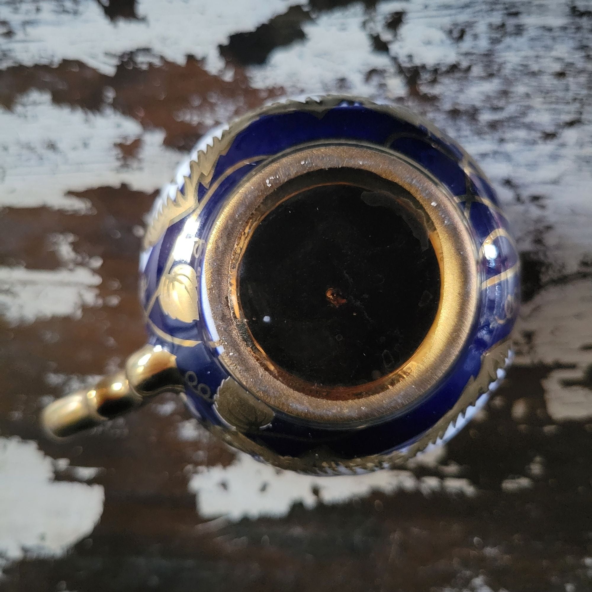 Vintage Cobalt Blue and Gold Porcelain Cup and Saucer with Floral Pattern