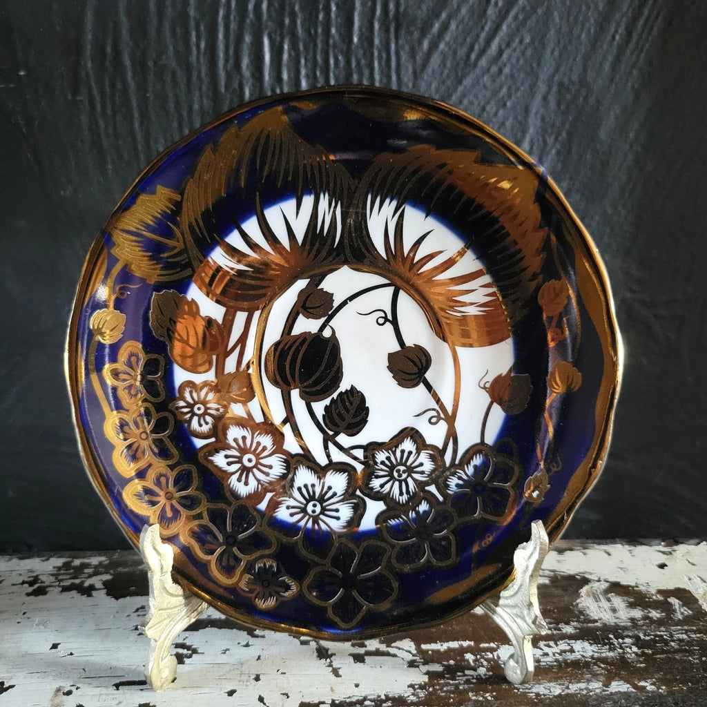 Vintage Cobalt Blue and Gold Porcelain Cup and Saucer with Floral Pattern