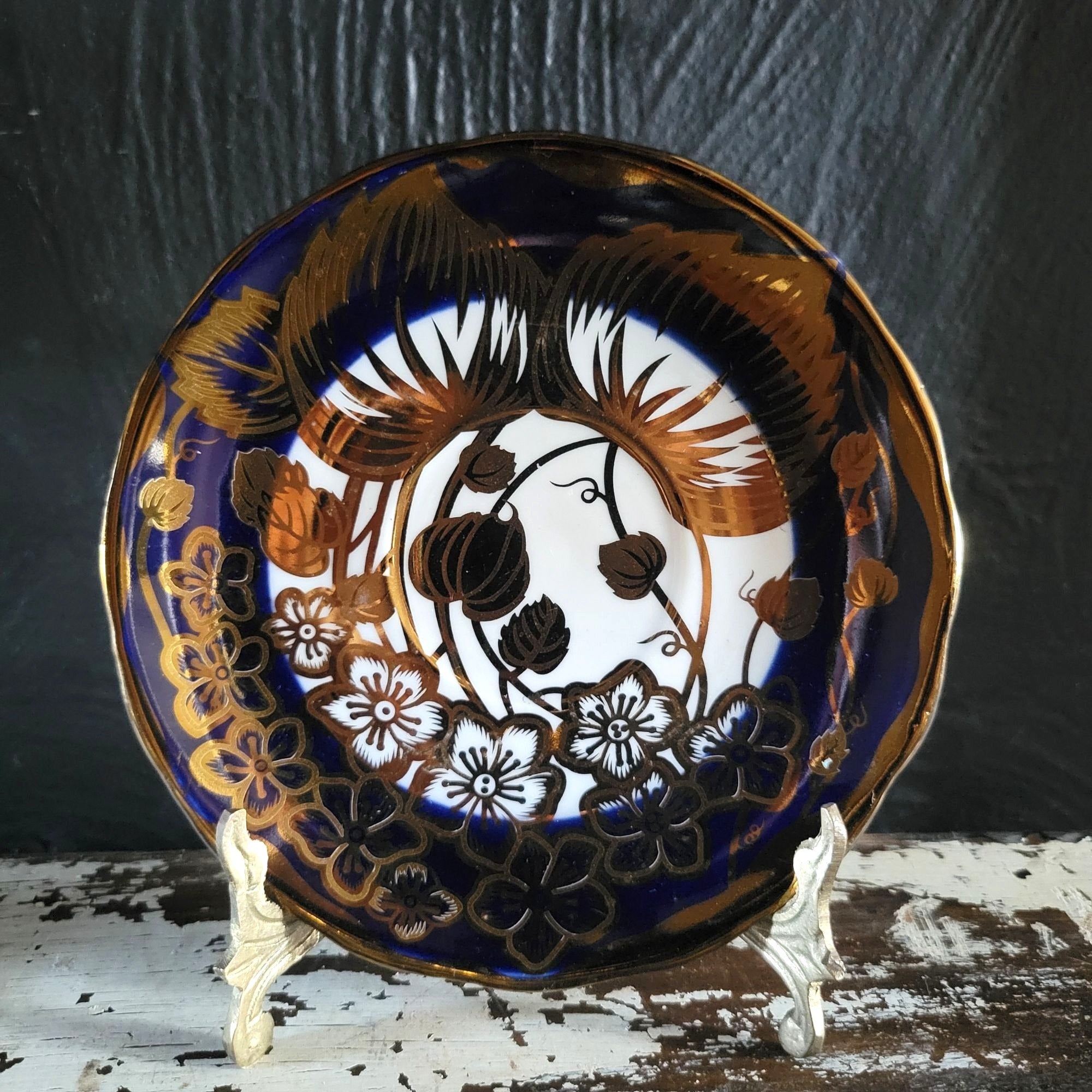 Vintage Cobalt Blue and Gold Porcelain Cup and Saucer with Floral Pattern