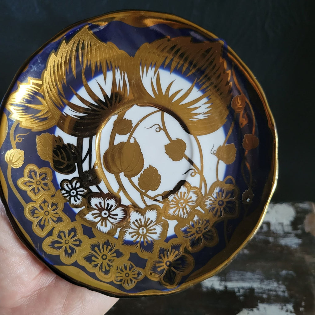 Vintage Cobalt Blue and Gold Porcelain Cup and Saucer with Floral Pattern