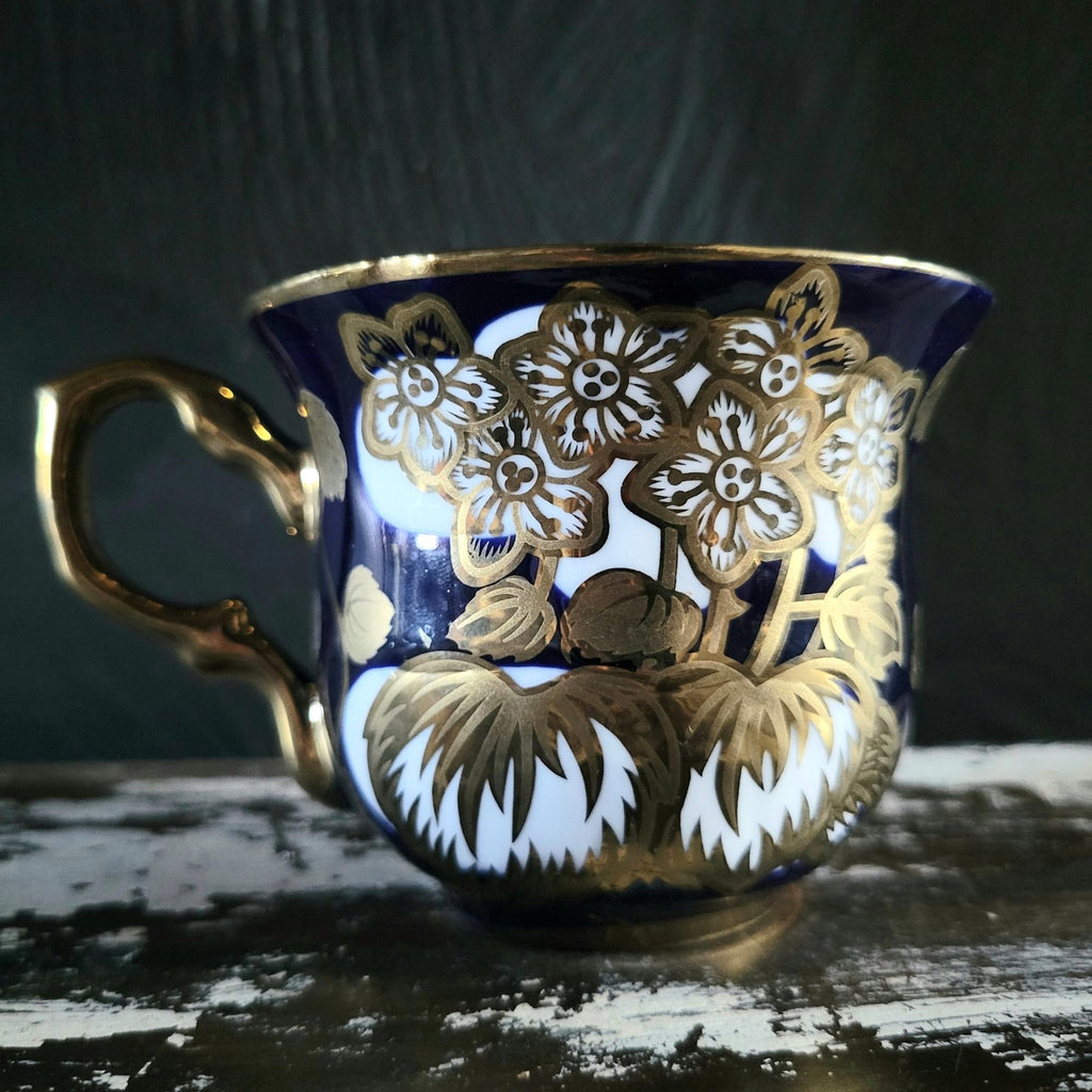 Vintage Cobalt Blue and Gold Porcelain Cup and Saucer with Floral Pattern