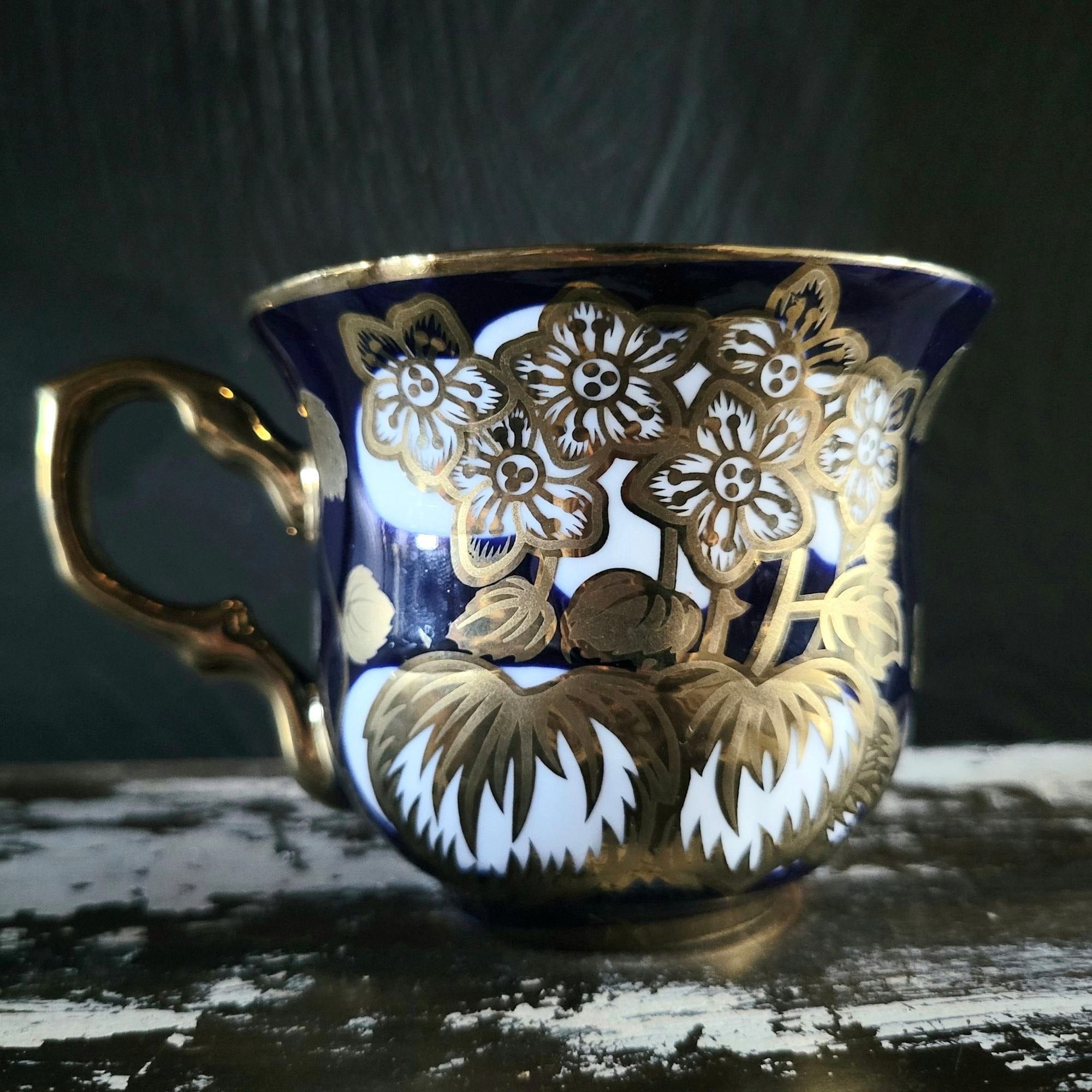 Vintage Cobalt Blue and Gold Porcelain Cup and Saucer with Floral Pattern