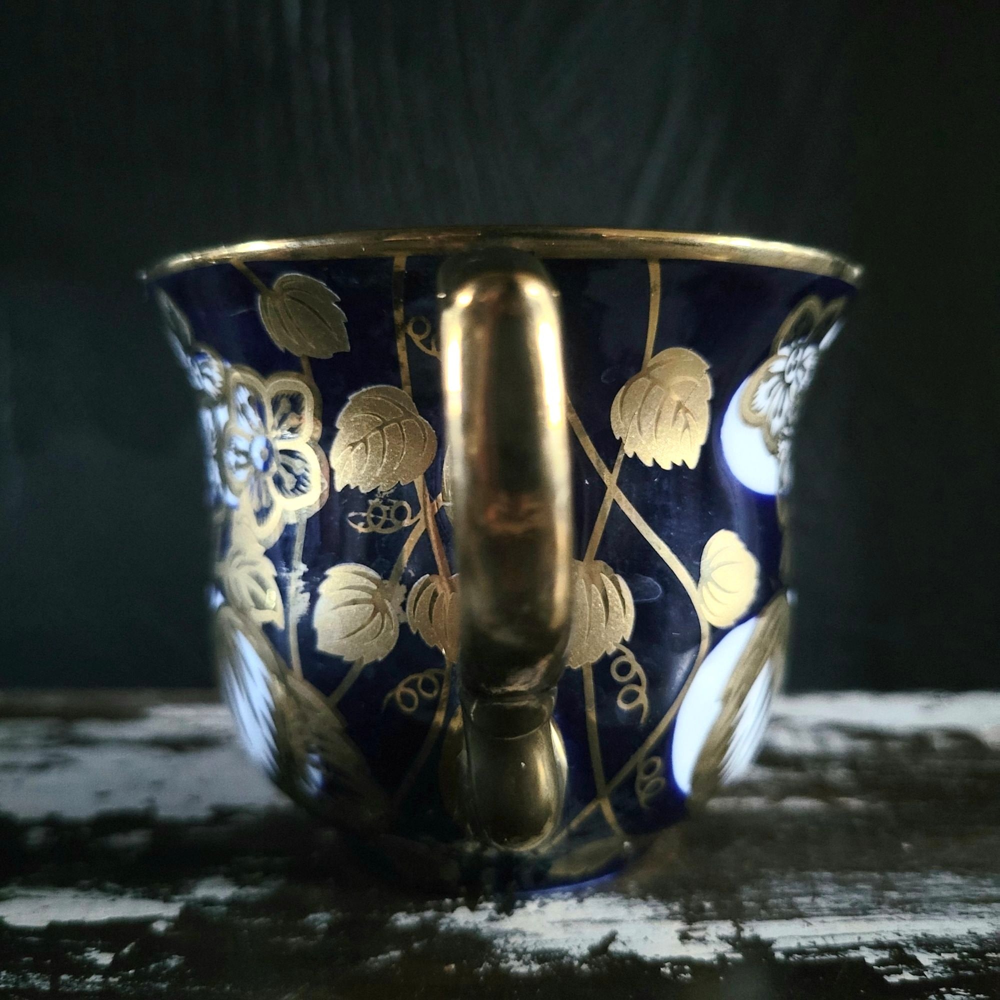 Vintage Cobalt Blue and Gold Porcelain Cup and Saucer with Floral Pattern