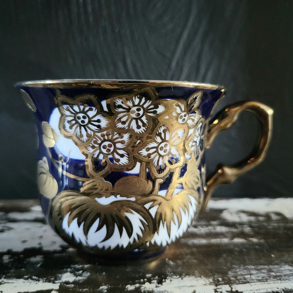 Vintage Cobalt Blue and Gold Porcelain Cup and Saucer with Floral Pattern