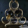 Vintage 6-Bottle Tabletop Brass Wine Rack With Ornate Circular Ring Holders