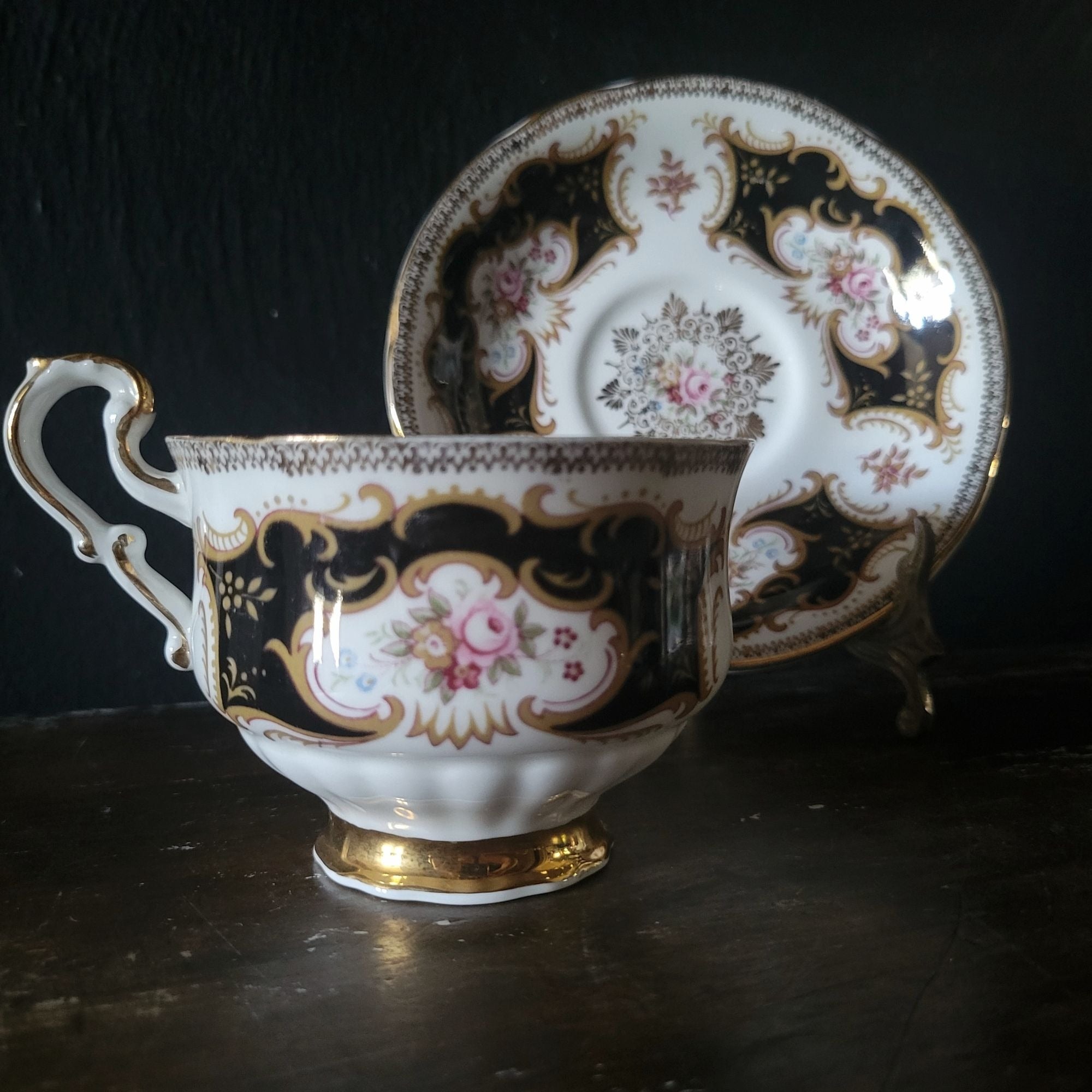 Vtg Paragon By Appointment To Her Majesty Tea Cup & Saucer Black Gold & Floral