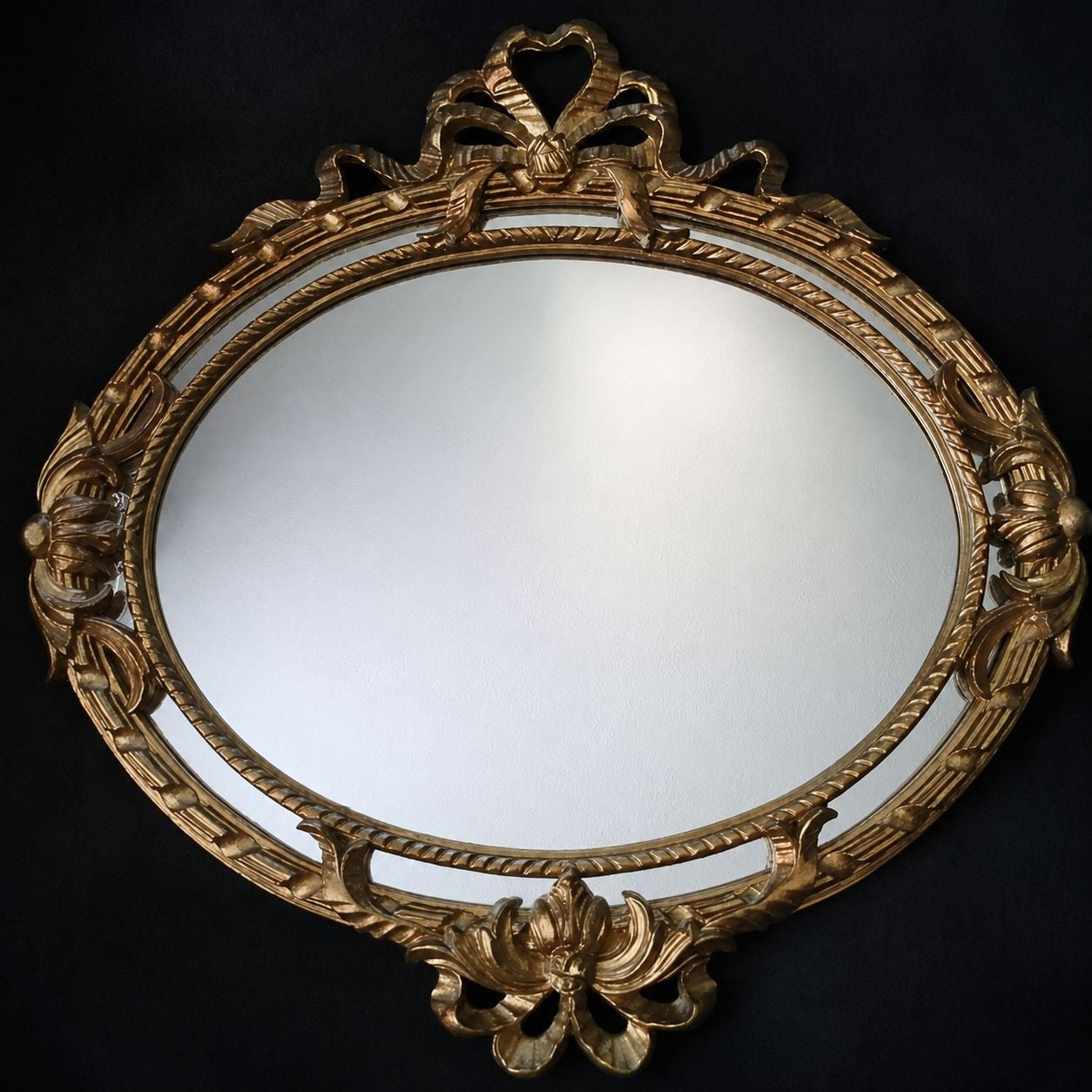 Vintage Italian Gold Oval Wall Mirror With Ornate Floral and Ribbon Design